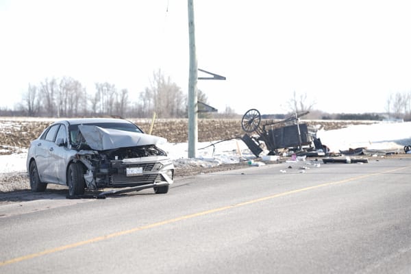 Collision between a car and a horse-drawn buggy