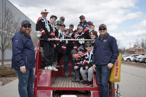 Three Woolwich teams take victory lap aboard firetruck