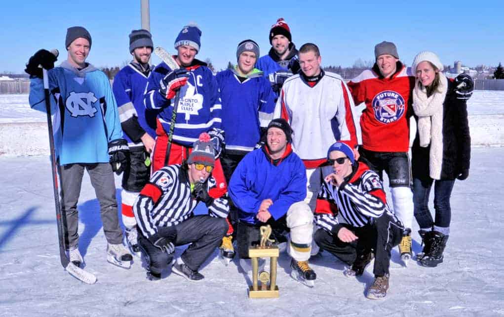The winning team poses with their trophy and Nathan and Emma Harris at the end of a tournament put together Jan. 25 by friend