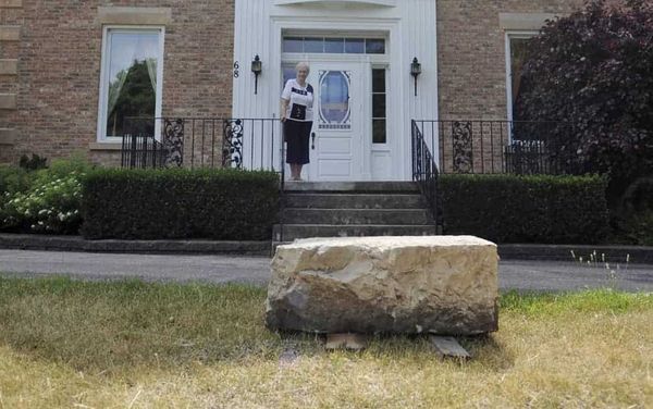 Contractors working on Woolwich St. find carriage stone buried during project four decades earlier