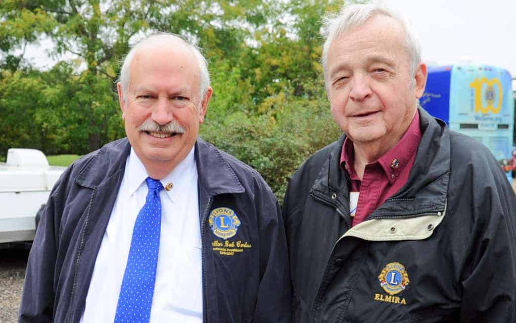 Lions International president Bob Corlew with Art Woods in Breslau.