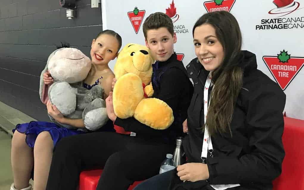 Sophia Kagolovskaya and Kieran MacDonald are joined by their coach Carleigh MacDonald at the competition last month that wrap