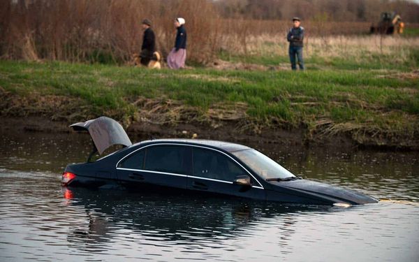 Photo Gallery: Vehicle lands in Conestogo River on Three Bridges Rd