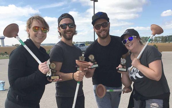 On toilets atop, plungers go plop in Optimist Club fundraiser
