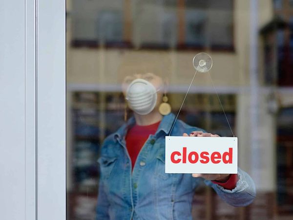 woman in closed shop with mask - your text closed
