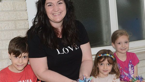 Creating paper cranes as a symbol of hope and peace