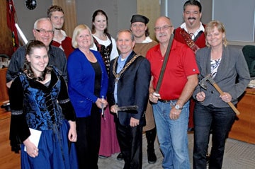 Woolwich council chambers saw some swashbuckling Tuesday night courtesy of a visit from some of the organizers of the Robin in the Hood Medieval Festival. Front: Shayna Meadows with council members Allan Poffenroth, Bonnie Bryant, Todd Cowan, Mark Bauman and Julie-Anne Herteis. Back: Sherwood Forest denizens Tyler Lubberts, Sarah Landy, Caleb Fahey and DJ Carroll.[steve kannon / the observer]