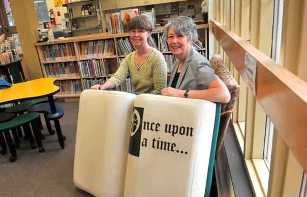 Elmira branch library staff members Carol Campbell (left) and Bette Cummings will be working different hours and handling various new programs suggested by the public.  [elena maystruk / the observer