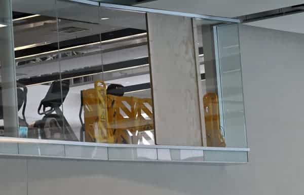 The fitness centre window is one of the few repairs still to be done.[Will Sloan / The Observer]