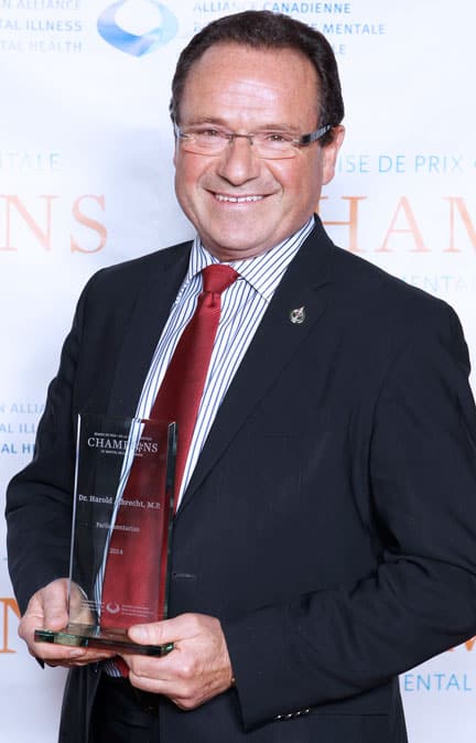 MP Harold Albrecht accepts an award for his work  on mental health issues.[Submitted]