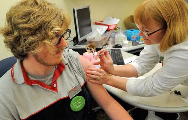 Evan Downey receives his flu shot at the Shoppers Drug Mart in Elmira, one of the locations offering the vaccine.[Whitney Neilson / The Observer]