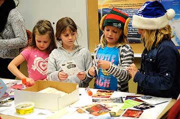 Youth at Crosshill Mennonite Church gathered Dec. 8 to fill 150 shoeboxes full of toys, cards, and other gifts for children around the world for Operation Christmas Child.[Whitney Neilson / The Observer]