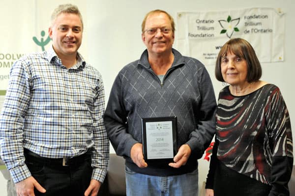Kitchener-Conestoga MPP Michael Harris and Ruby Weber presented the $150,000 cheque from the Ontario Trillium Foundation to Don Harloff at Woolwich Community Services’ new location last week.[Whitney Neilson / The Observer]