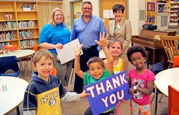 John Mahood Public School students Branden Leis, Wyatt Switjers, Lauren Weber and Tejitu Lebold, participants in Strong Start’s Letters, Sounds and Words program, thanked Josslin Insurance for its support of the program at their school. From left, Josslin’s marketing co-ordinator Amanda Scheerer, partner and operations manager Scott Wagler and Strong Start executive director Machelle Denison. [Submitted]