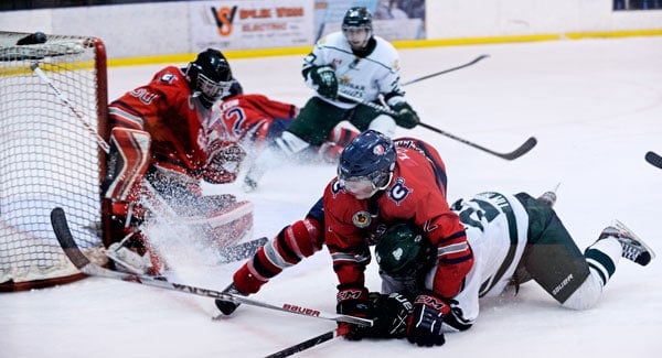 Chad Herron, who led the team with two goals, gets tangled up with a Culliton player.[Whitney Neilson / The Observer]