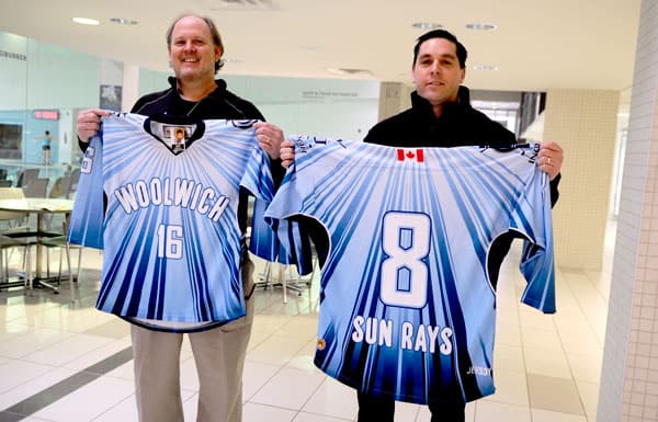 Past Crime Stoppers chair Patrick DeLay and Crime Stoppers coordinator Darryl Paquette show off the donated jerseys for the team. The organization has partnered with Woolwich Minor Hockey, Woolwich Township and the Elmira District Community Living to bring the team to fruition.[Whitney Neilson / The Observer]
