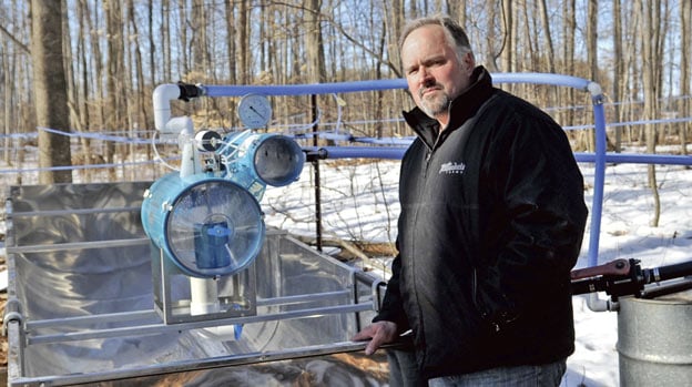 With some 10,000 taps on trees across a number of sugar bushes in the township, Fred Martin hopes to produce more than 10,000 litres of maple syrup this year. [Scott Barber / The Observer]