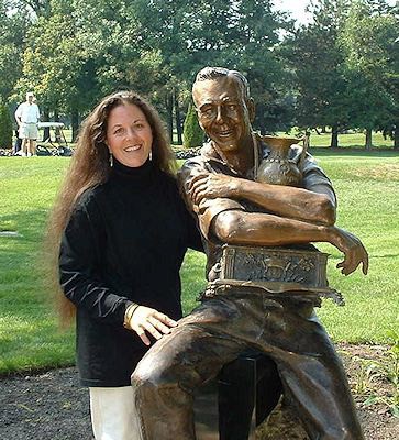Ruth Abernathy stands beside her sculpture of Arnold Palmer. [Submitted]