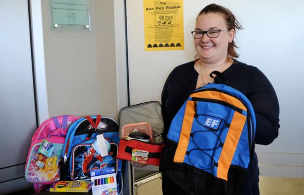 Summer student Megan Andrews is busy helping Woolwich Community Services collect supplies for their annual backpack program. [Whitney Neilson / The Observer]