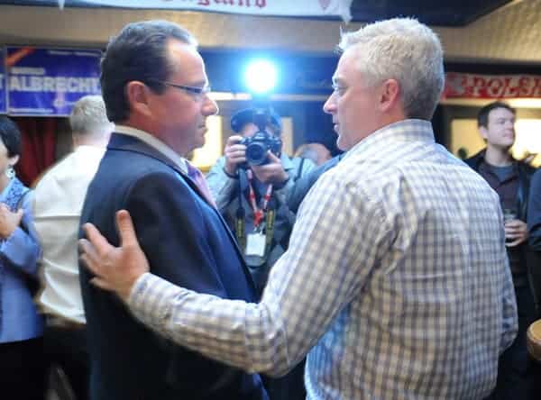 All eyes were on Kitchener-Conestoga MP Harold Albrecht and MPP Michael Harris, the only Conservatives left in Waterloo Region, as they chatted prior to Albrecht’s win on Monday night. The incumbent held onto his seat by 351 votes as the Liberals swept back to power nationally.[Whitney Neilson / The Observer]
