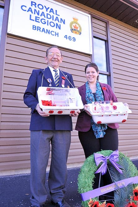 Bill Strauss, poppy campaign chair and former Woolwich mayor, organizes some of the 37,000 poppies circulating around the township for Remembrance Day 2015. To honour veterans, the local Legion will be holding a parade and ceremony on Nov. 8 at 2:30 p.m. in Elmira.[Liz Bevan / The Observer]
