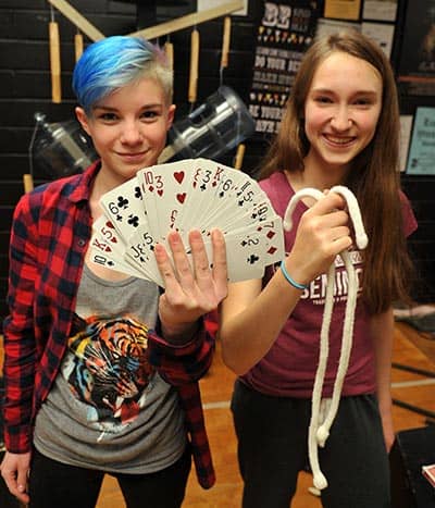 Naomi Jenzen and Savanah Campbell, Grade 11 students at Elmira District Secondary School, are practicing for their upcoming magic show, open to the public on Jan. 21 at 6:30 p.m. Abracadabra![Liz Bevan / The Observer]