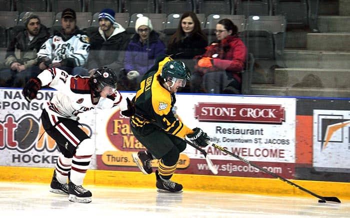 Elmira Sugar Kings captain Rob Kohli keeps the puck away from the Brantford 99ers on Sunday night at Dan Snyder Arena. The Kings skated to a convincing 6-0 victory.[Liz Bevan / The Observer]