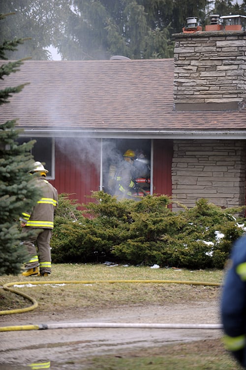 Fire crews from St. Jacobs and Conestogo were on scene at a house fire Apr. 7 on Country Squire Road. The fire was called in by a neighbour, a volunteer firefighter, just before 5 p.m.[Liz Bevan / The Observer]