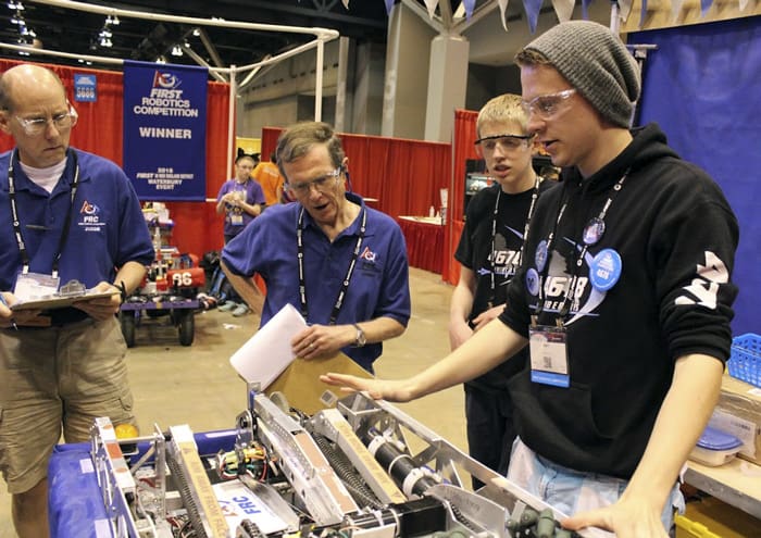 The CyberCavs robotics team explains their machine to the judges at the World Championship contest in St. Louis, Missouri at the end of last month.[Submitted]