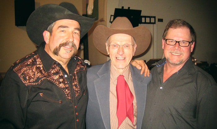 Johnny Burke kicks off the Commercial Tavern’s new Saturday afternoon concert schedule this weekend. Burke is flanked by the venue’s owner, Paul Weber (left), and the guitarist who’ll be joining him on stage, Joe Howe. [Submitted]