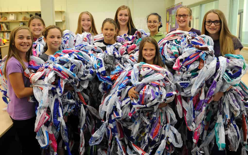 The WE Team at Wellesley Public School are making 10 milk bag beds to be sent to people in other countries through MILKBAGSunlimited. They spent the previous school year collecting 5,000 milk bags. Back row: Ashley MacGillivray, Leah McDonald, Heidi McDonald, Rafaela Bononka, Emily Barten, Kaitlyn MacGillivray. Front row: Kylee Metzger, Mia Thompson, Bella Snyder, Erin Zyta.[Whitney Neilson / The Observer]