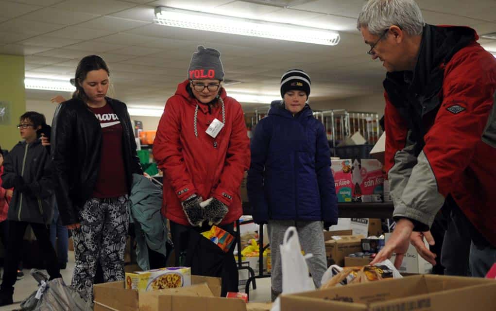 Despite rain and snow, volunteers came out in droves for the Kiwanis Club of Elmira’s Woolwich Christmas Goodwill Food Drive on Nov. 19. Food drive co-chair Fred Karpala estimated they gathered around 20,000 pounds of food for Woolwich Community Service’s Christmas hampers. [Whitney Neilson / The Observer]