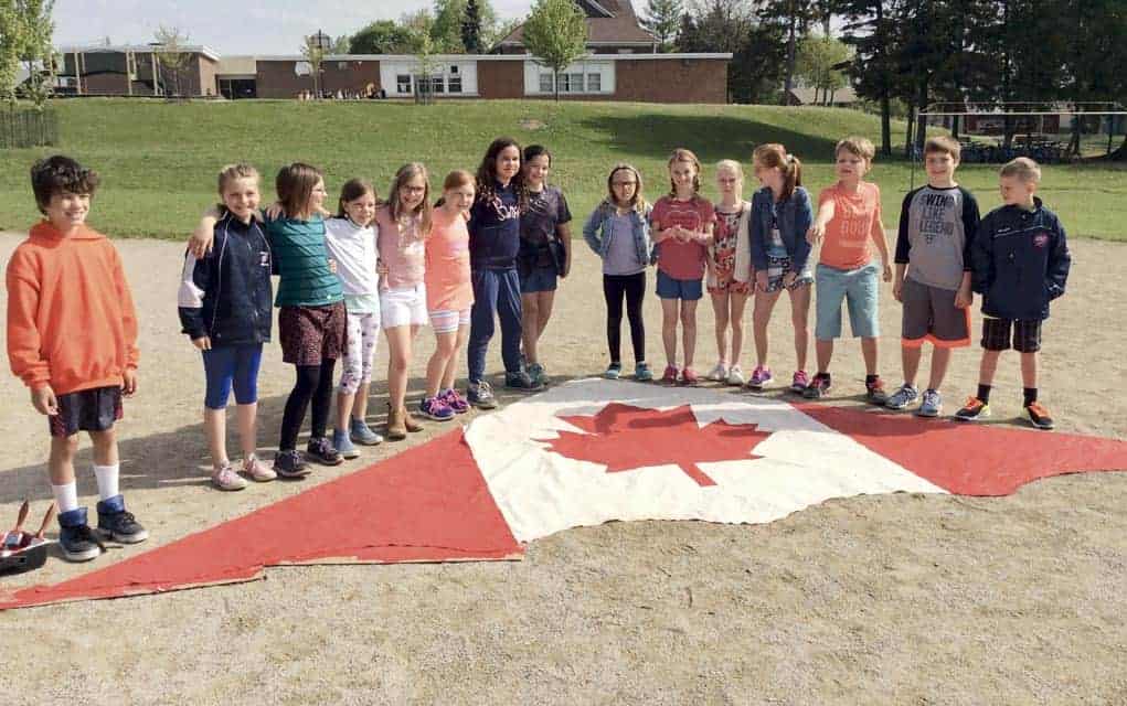 St. Jacobs PS students colour up a Canadian-themed kite to mark the country’s 150th