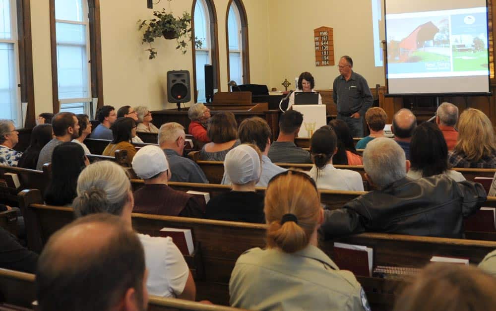 Residents call for improved communication at meeting to review June 23 flood