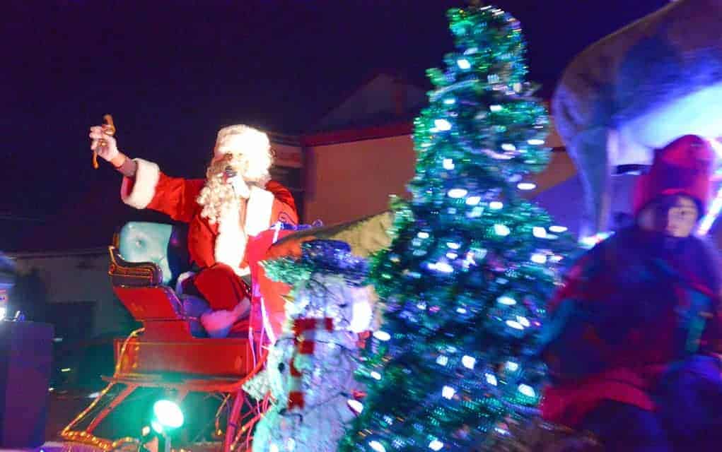 Santa Claus rode into Wellesley Friday evening for the annual Christmas Tyme parade, which features floats that light up the night. Photos by Ali Wilson / The Observer.